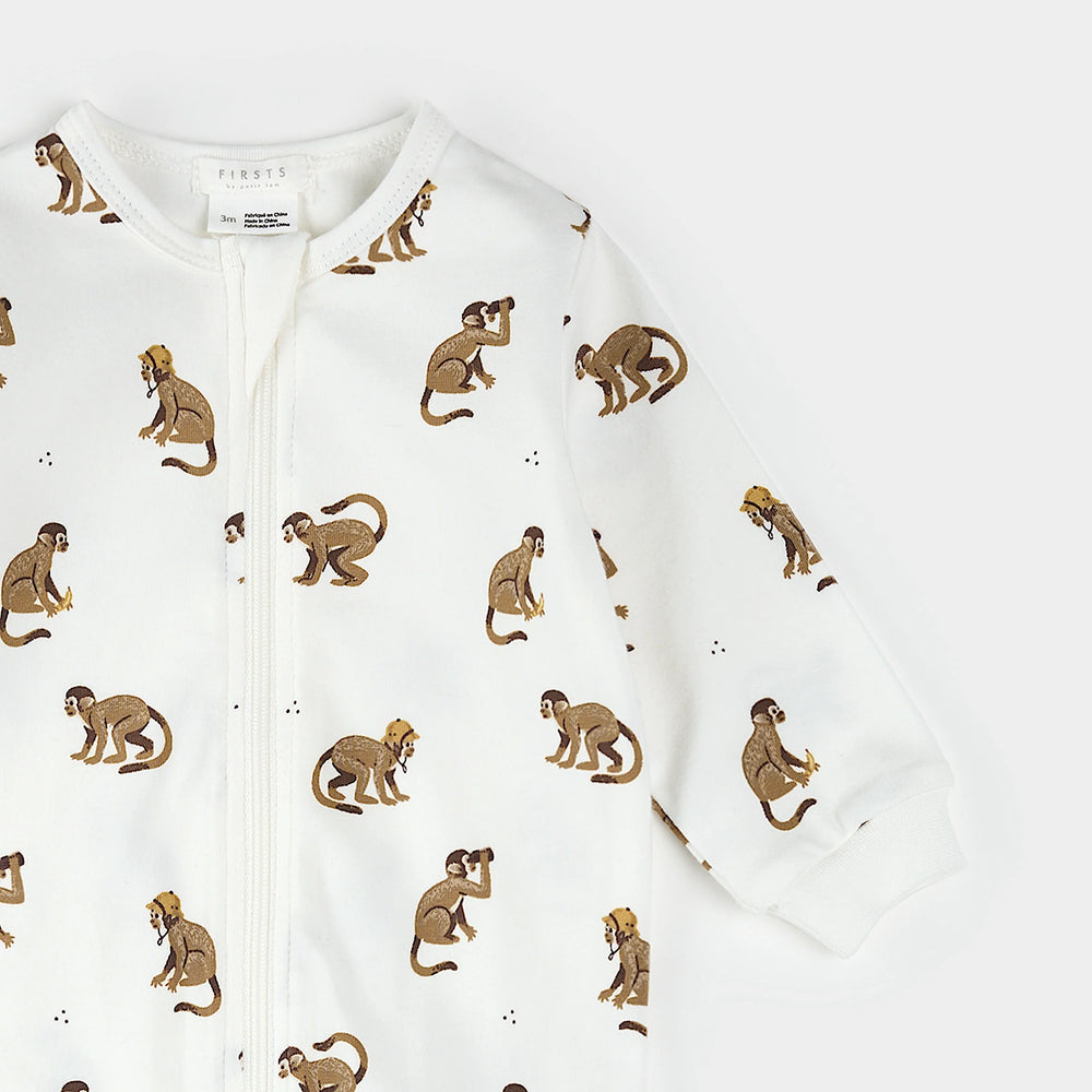 Back view close-up of monkey print baby footed sleeper 0–12 months