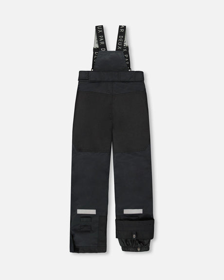 Black bib snow pants – back view with waterproof zippers and snow gaiters