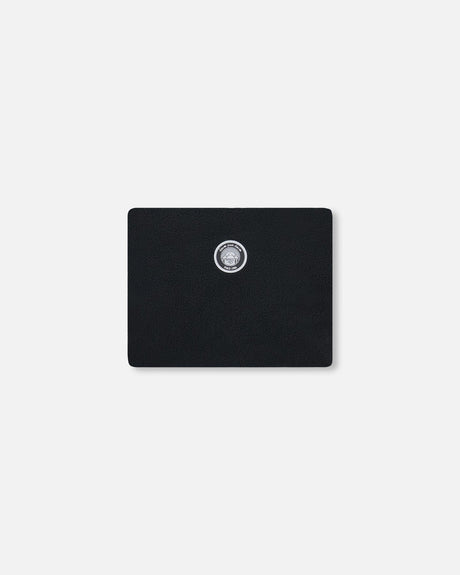 Color swatch detail — solid black Teknik snowsuit fabric