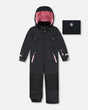 Front flat lay of black one-piece Teknik snowsuit with pink fleece-lined hood — Deux par Deux, PrimaLoft waterproof