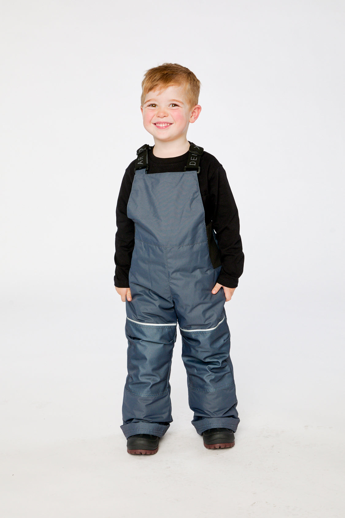 Child wearing the Deux par Deux DISCOVER snowsuit in Blue Bear Print, lookbook view