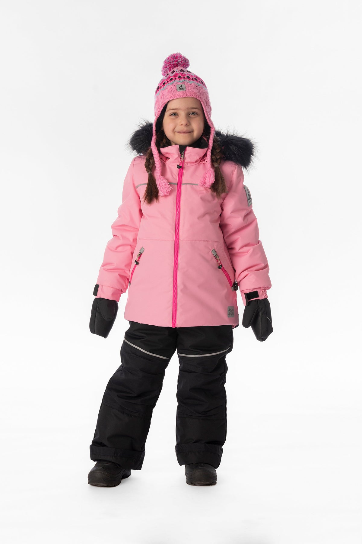 Child wearing the pink Deux par Deux DISCOVER snowsuit, lookbook view 1