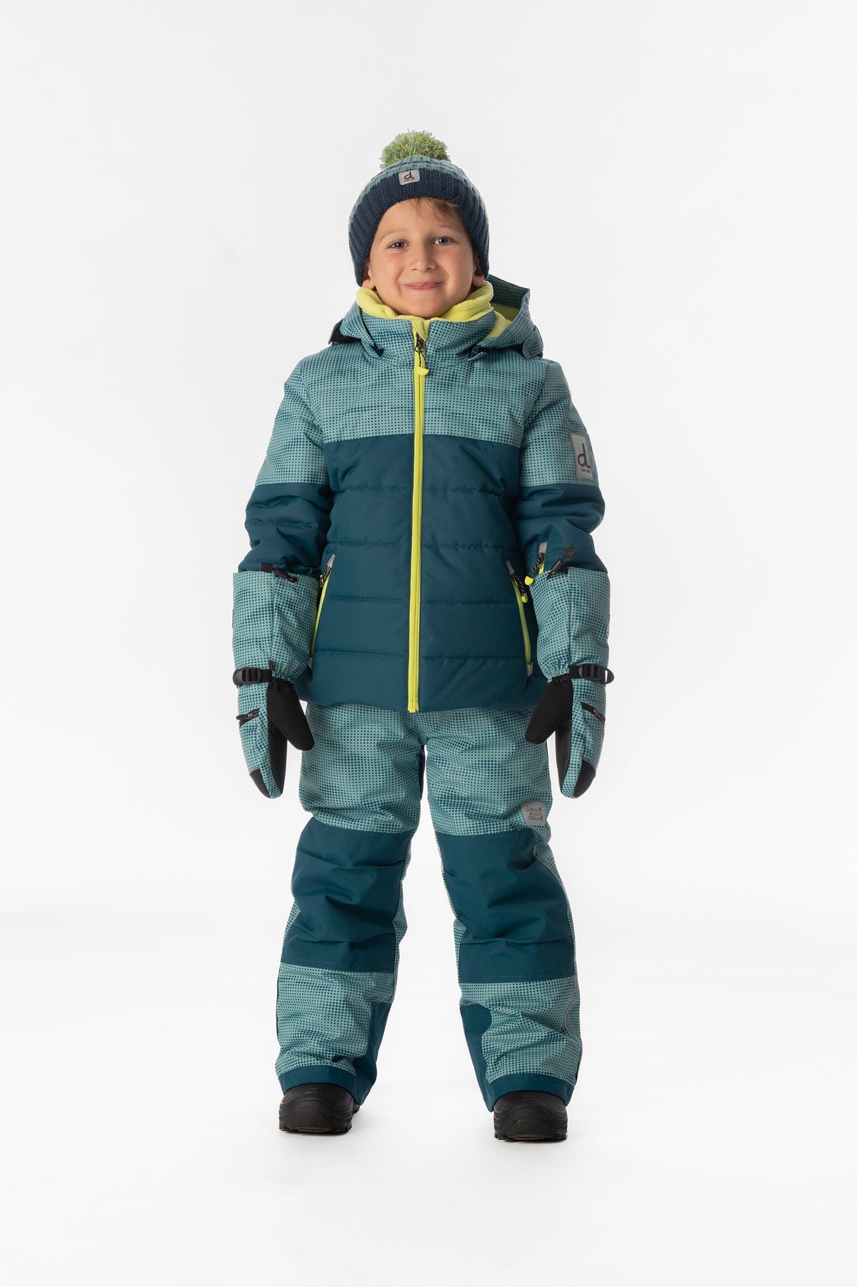 Child wearing the Deux par Deux greyish blue and navy PLAY two-piece snowsuit, lookbook photo 1