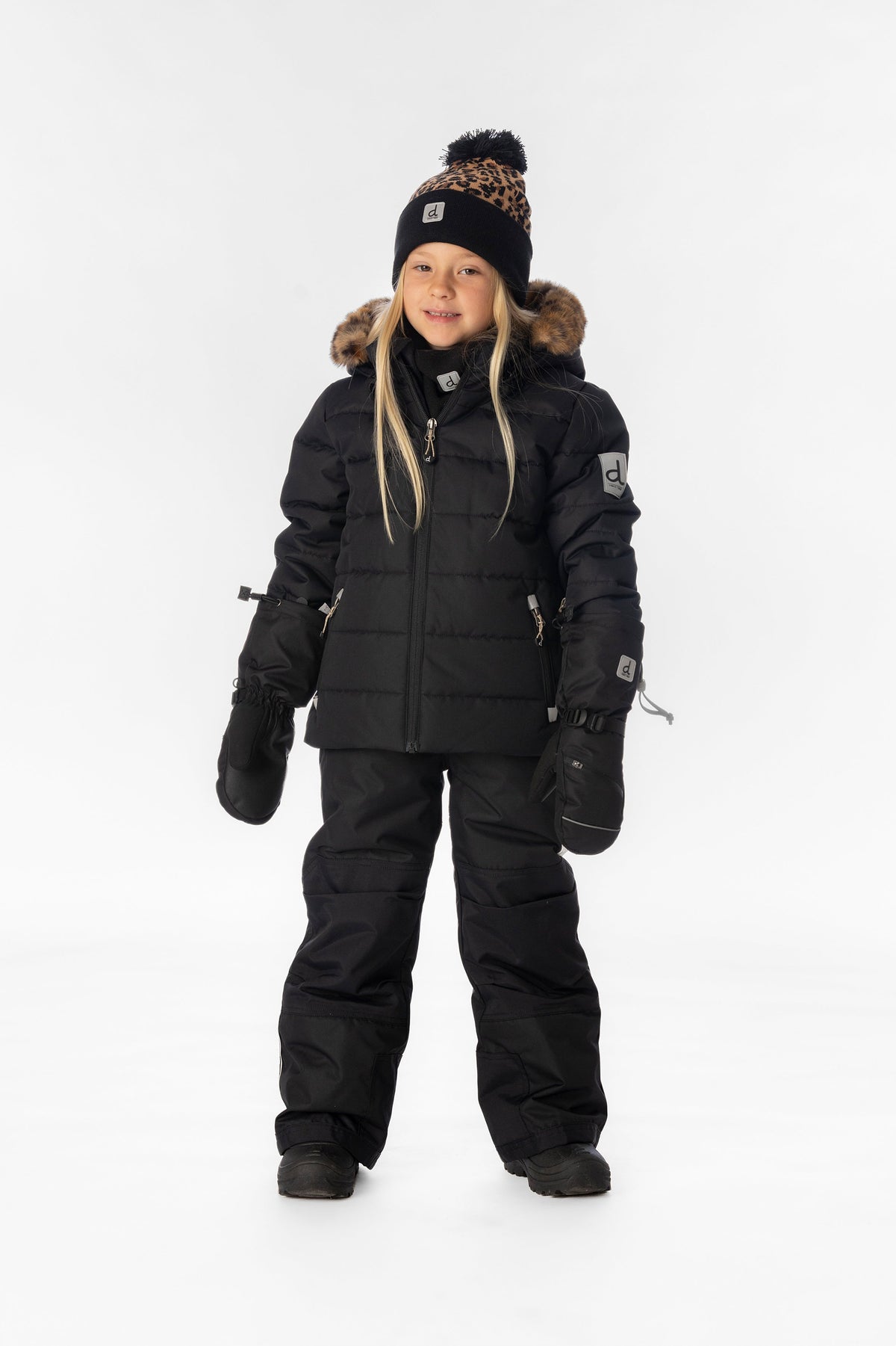 Child wearing the Deux par Deux black PLAY two-piece snowsuit, lookbook photo 1