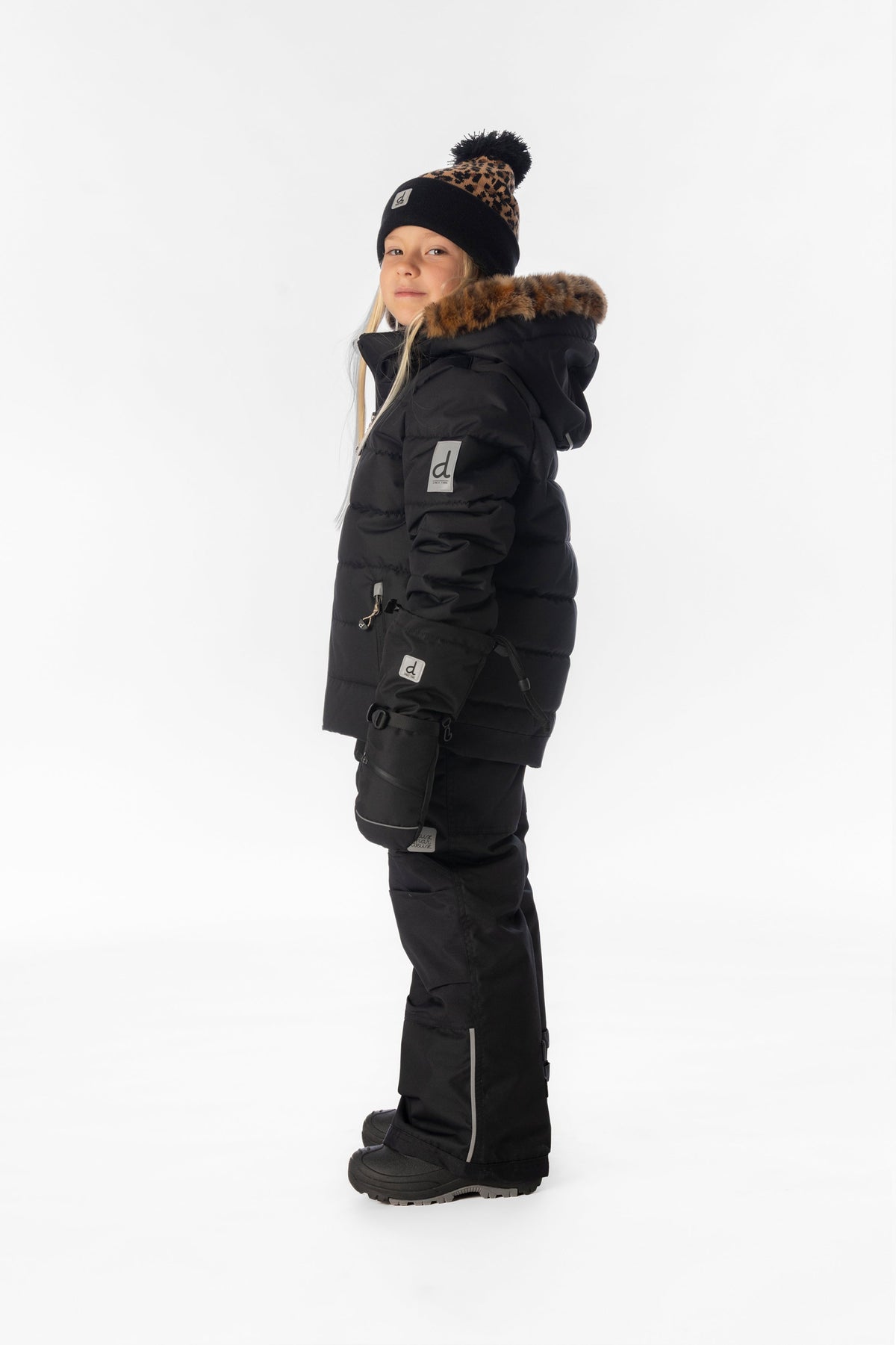 Child wearing the Deux par Deux black PLAY two-piece snowsuit, lookbook photo 2