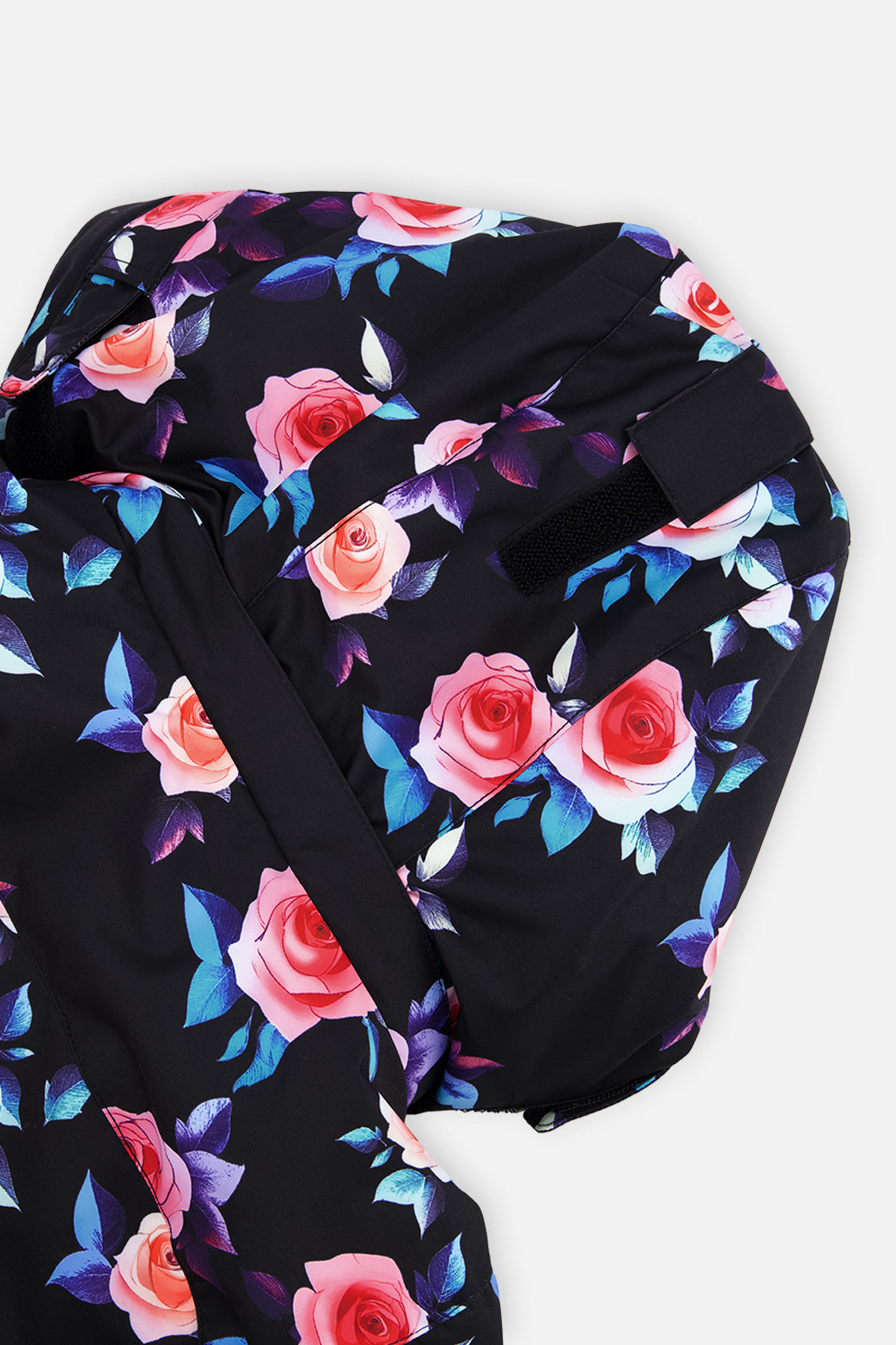 Deux par Deux girls' PLAY two-piece snowsuit in black rose print, further studio view