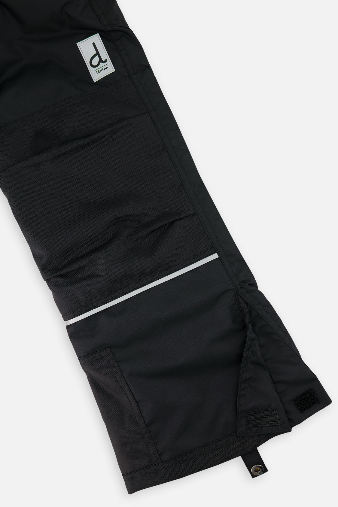 Deux par Deux boys' Teknik two-piece snowsuit in black and royal blue – snow pant leg and hem detail