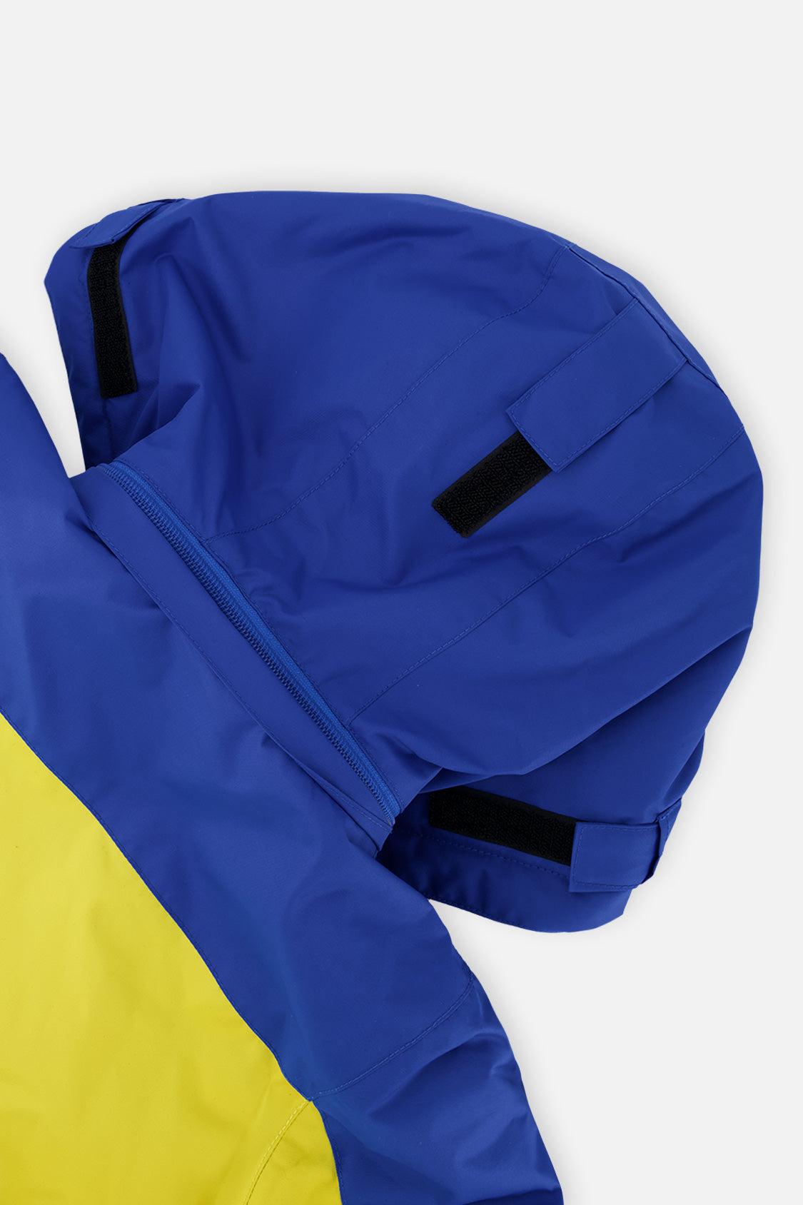 Deux par Deux boys' TEKNIK two-piece snowsuit in royal blue and yellow, further studio view