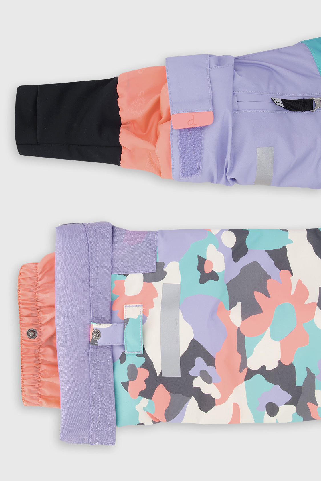 Deux par Deux girls' Teknik two-piece snowsuit in turquoise, orange and mauve color-block – sleeve cuff and pant hem details