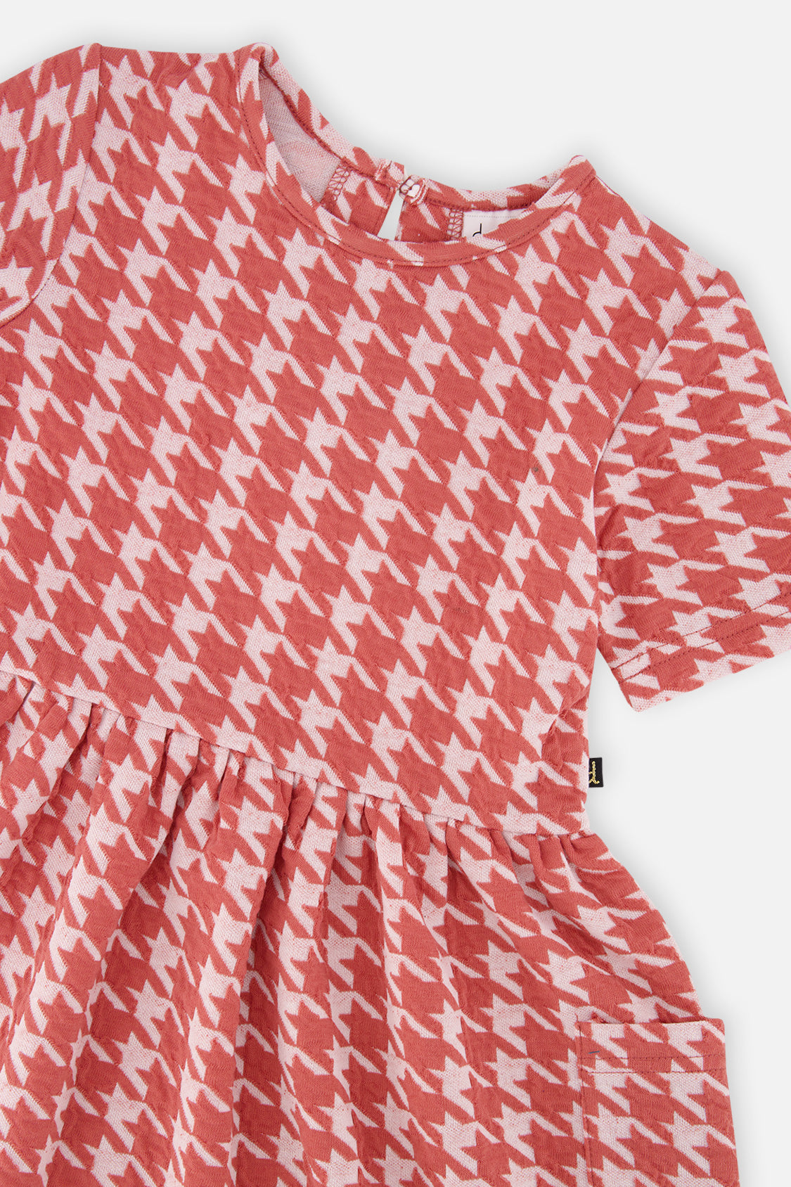 Close-up of the houndstooth jacquard and patch pocket on the Deux par Deux dress