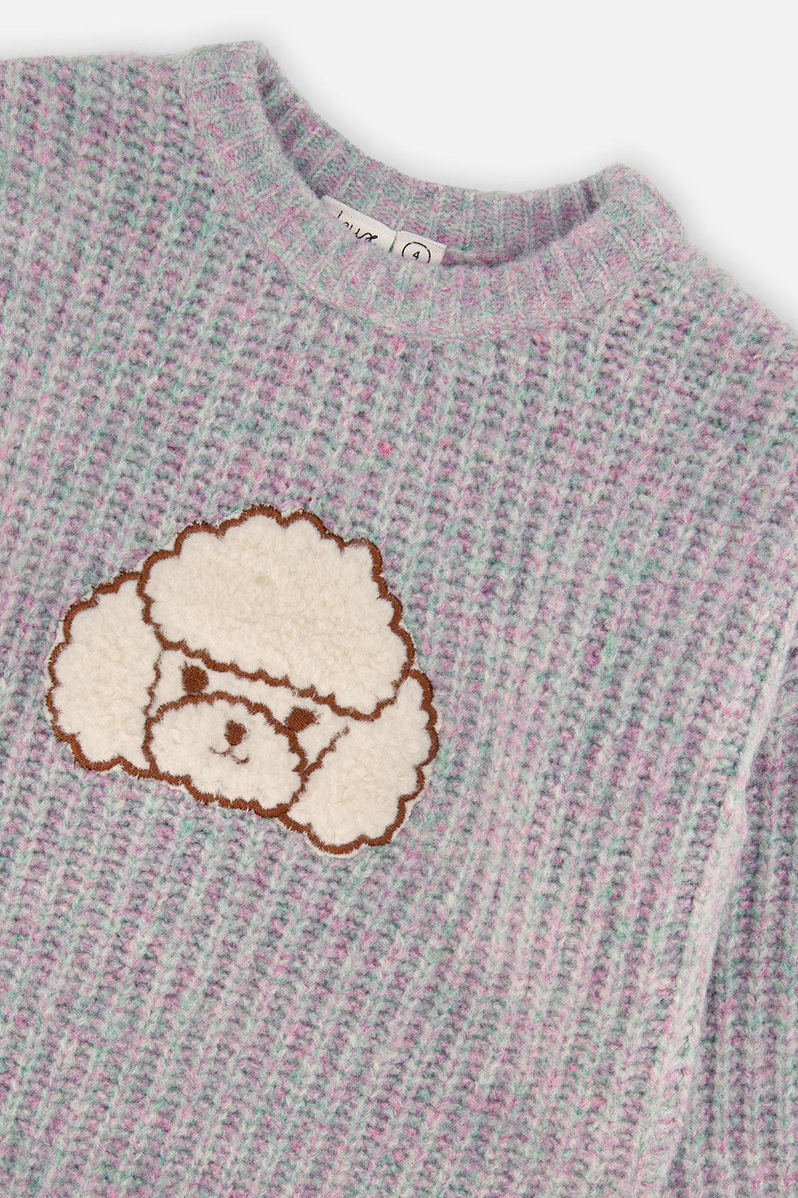 Close-up of the cream textured poodle and ribbed neckline on the lilac grey Deux par Deux sweater