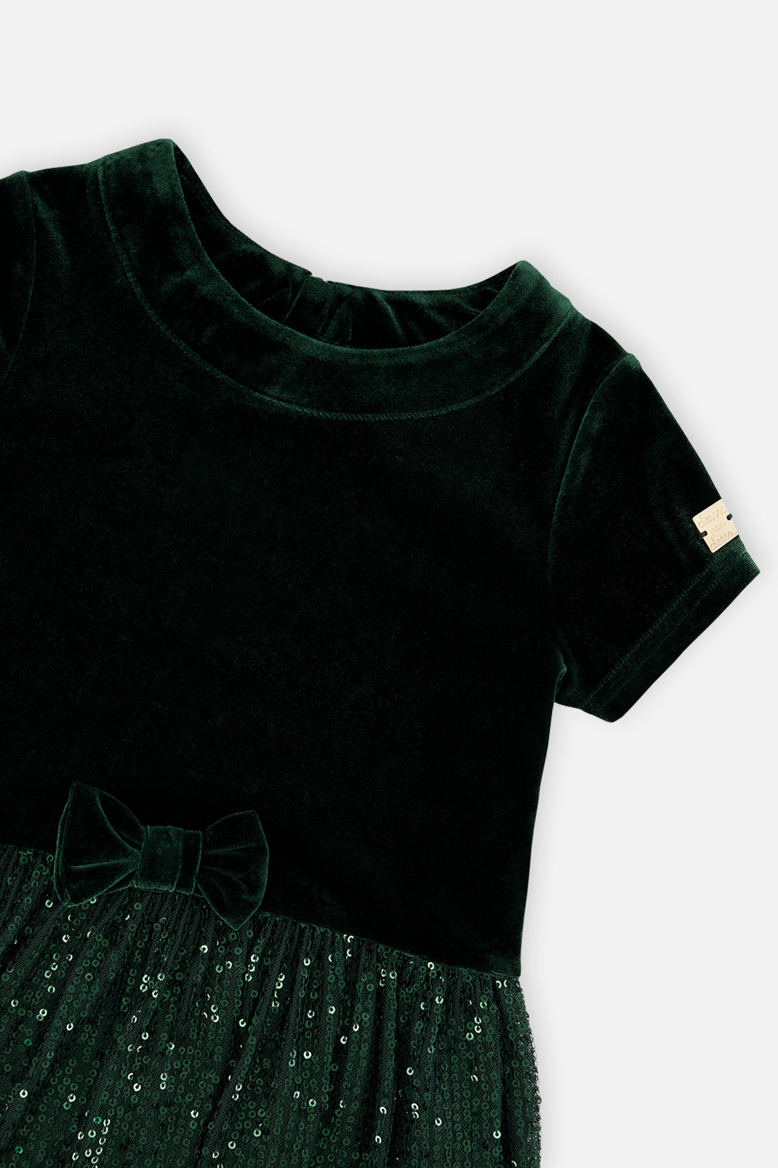 Close-up of the velvet neckline and bow on the Deux par Deux green party dress
