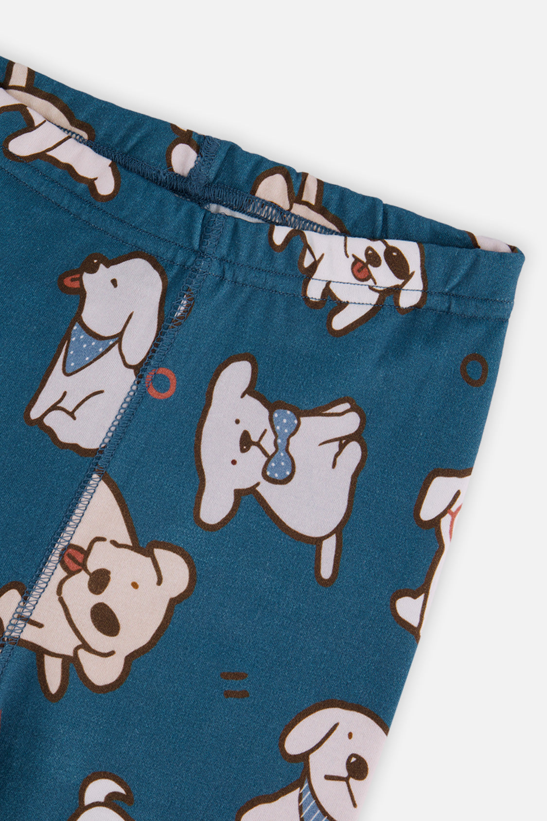 Close-up of the pants waist and leg seam covered in dogs with bandanas and bow ties