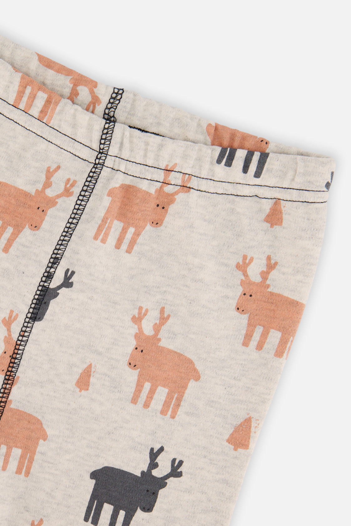 Close-up of the beige pants waist with orange and charcoal elk and the stitched leg seam