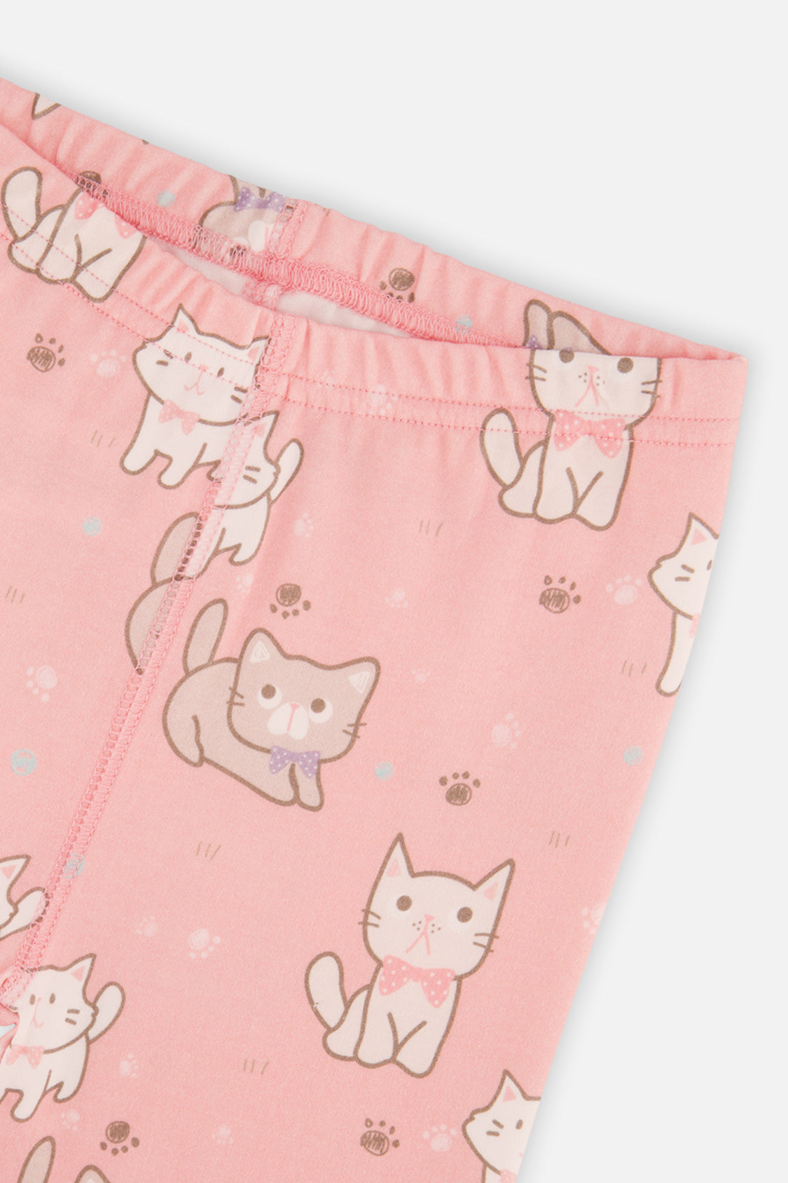 Close-up of the elastic waistband and cat and paw print on the pink pants