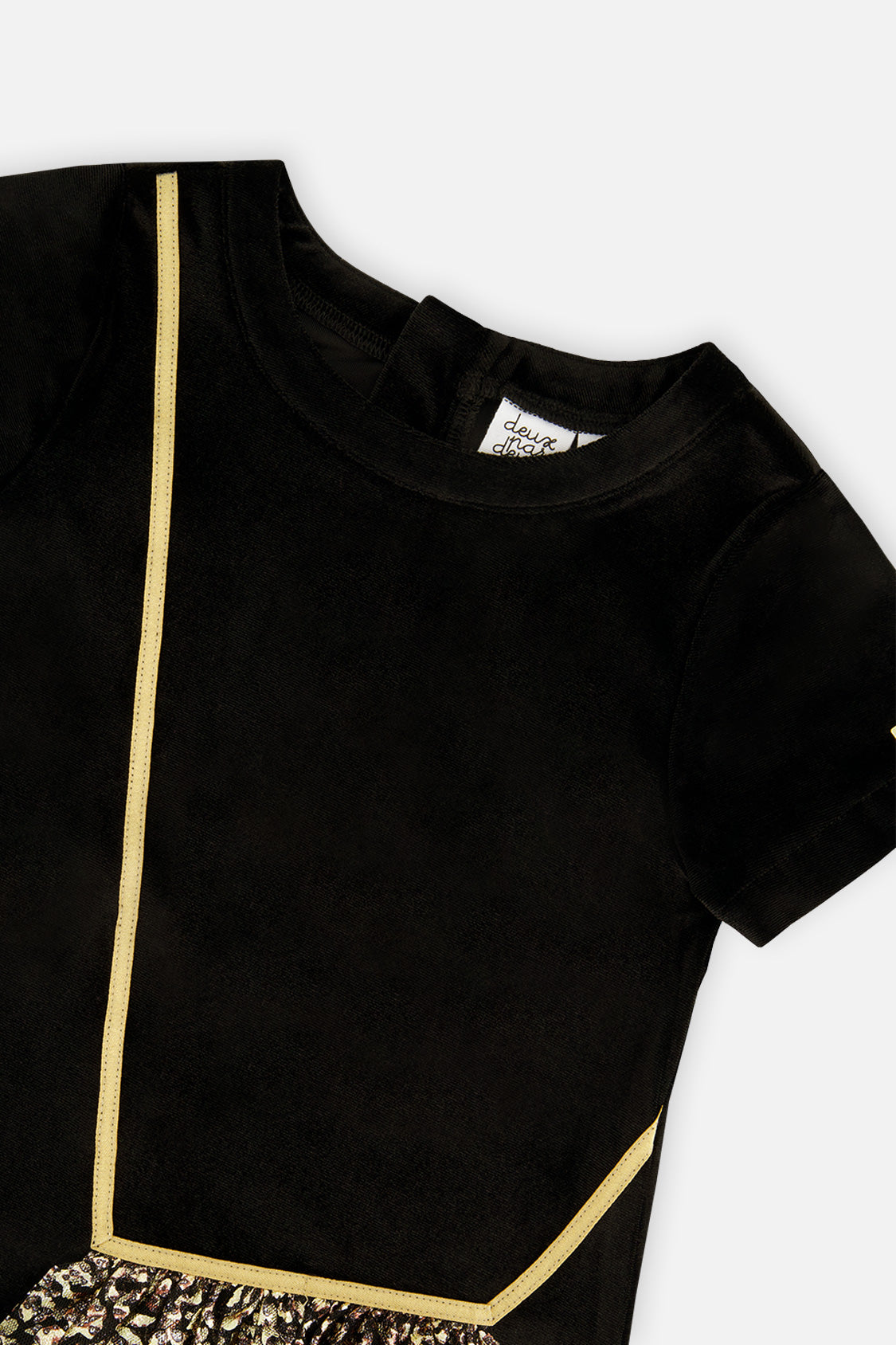 Close-up of the gold cord trim and neckline on the Deux par Deux black velour dress