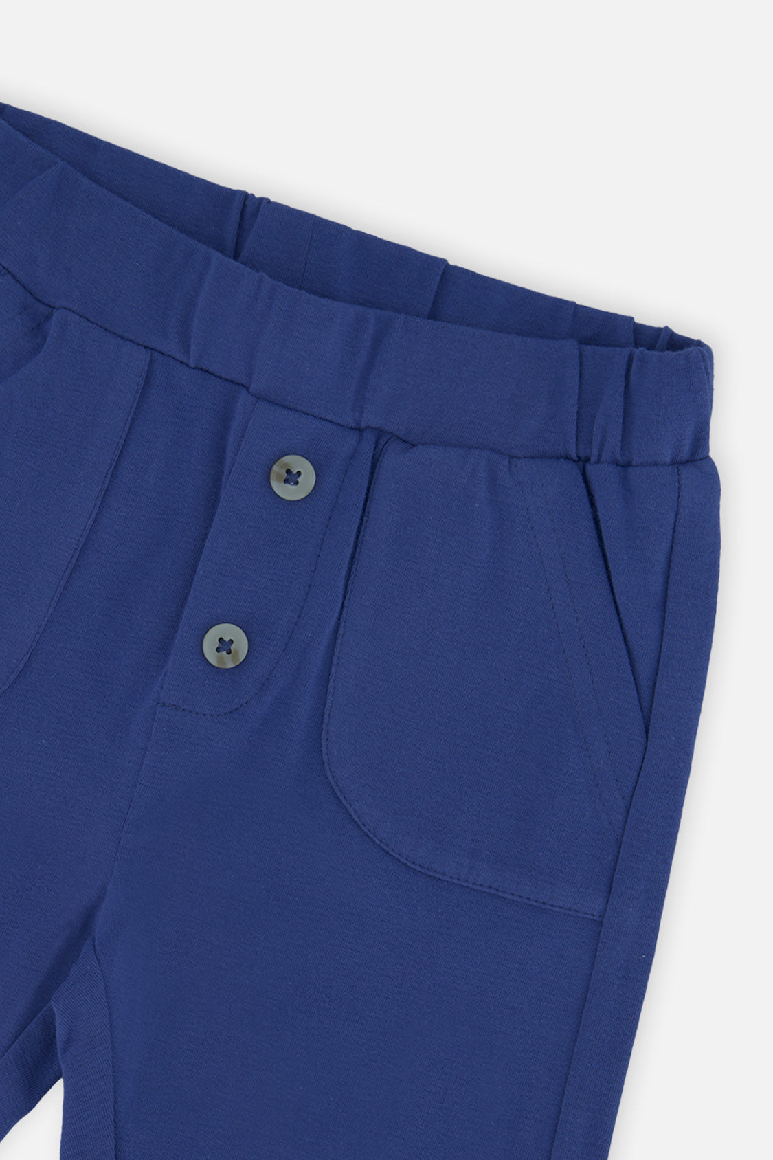 Close-up of the two-button waist and patch pocket on the Deux par Deux royal blue pants