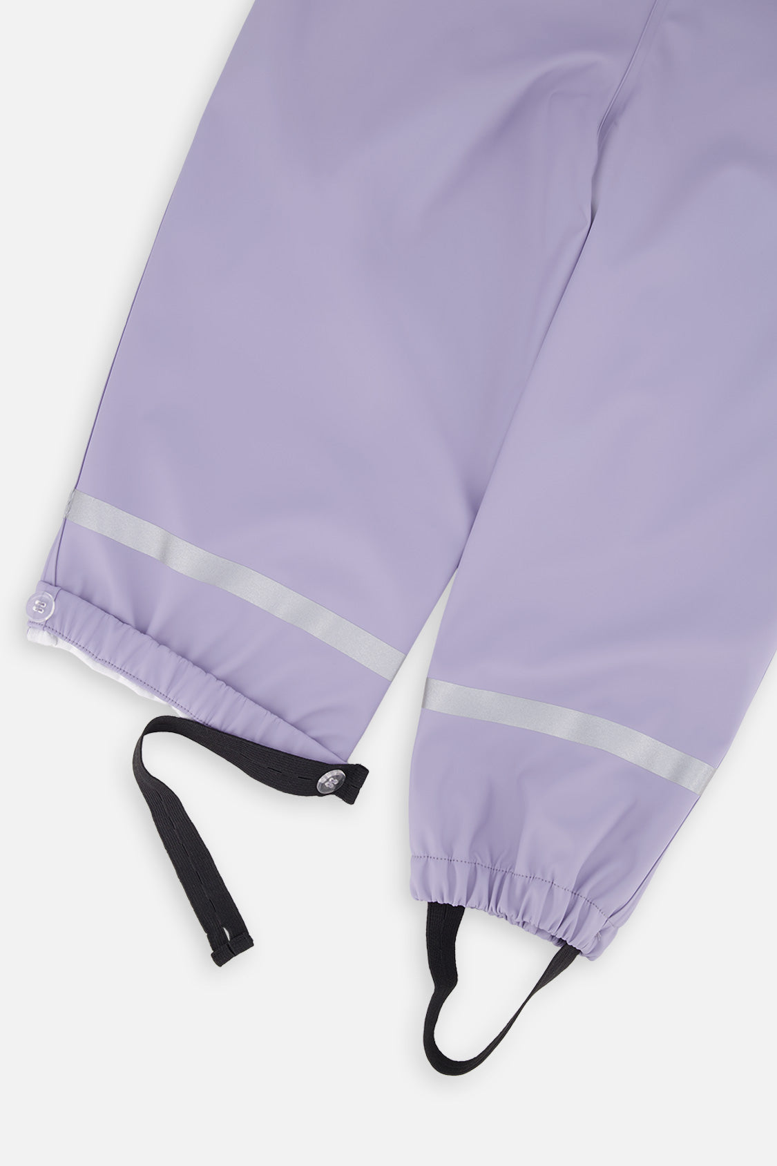 Close-up of the mauve rain overalls ankles with reflective bands, elastic cuffs and foot straps