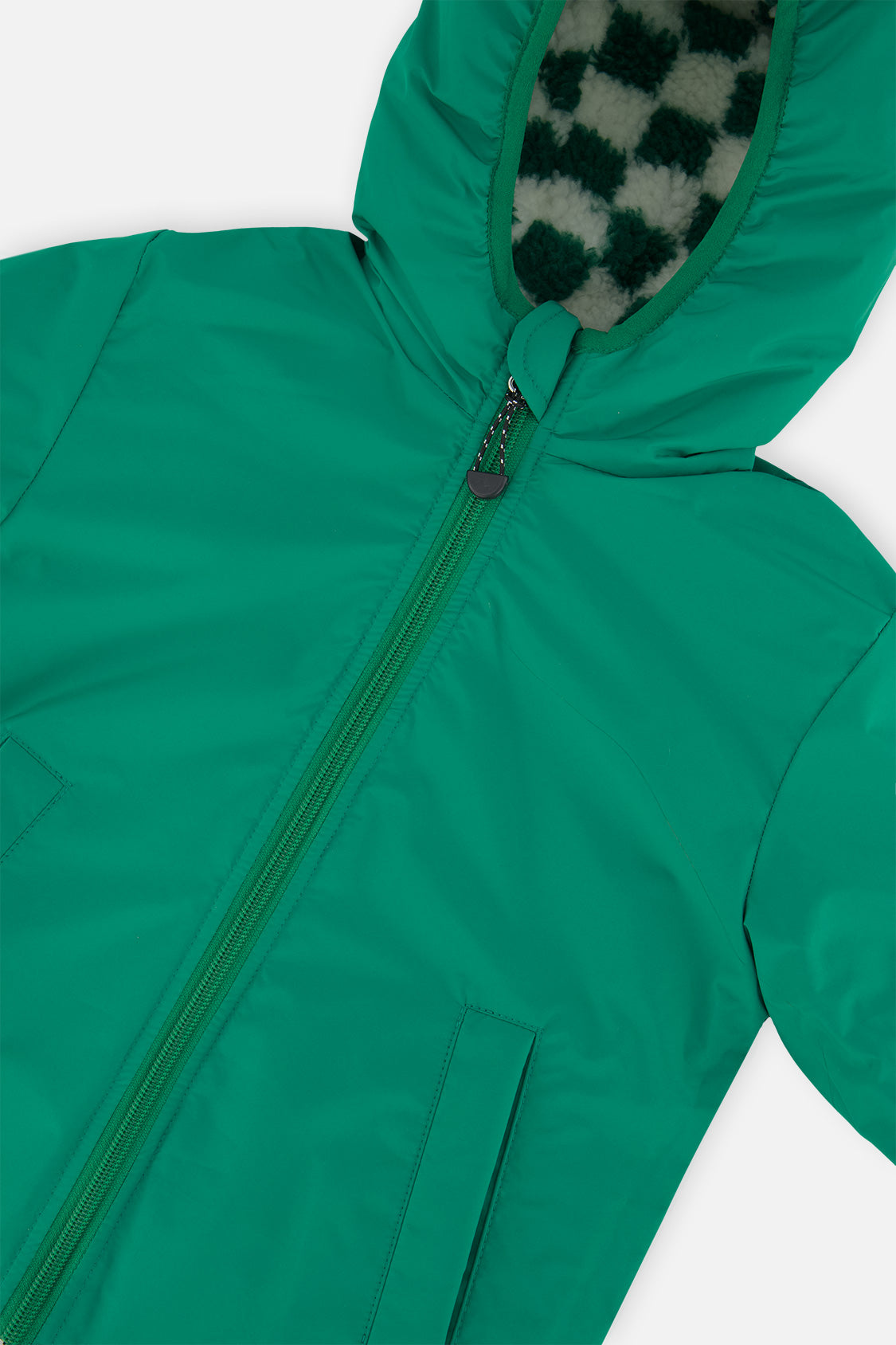Close-up of the green coated side, zipper and hood