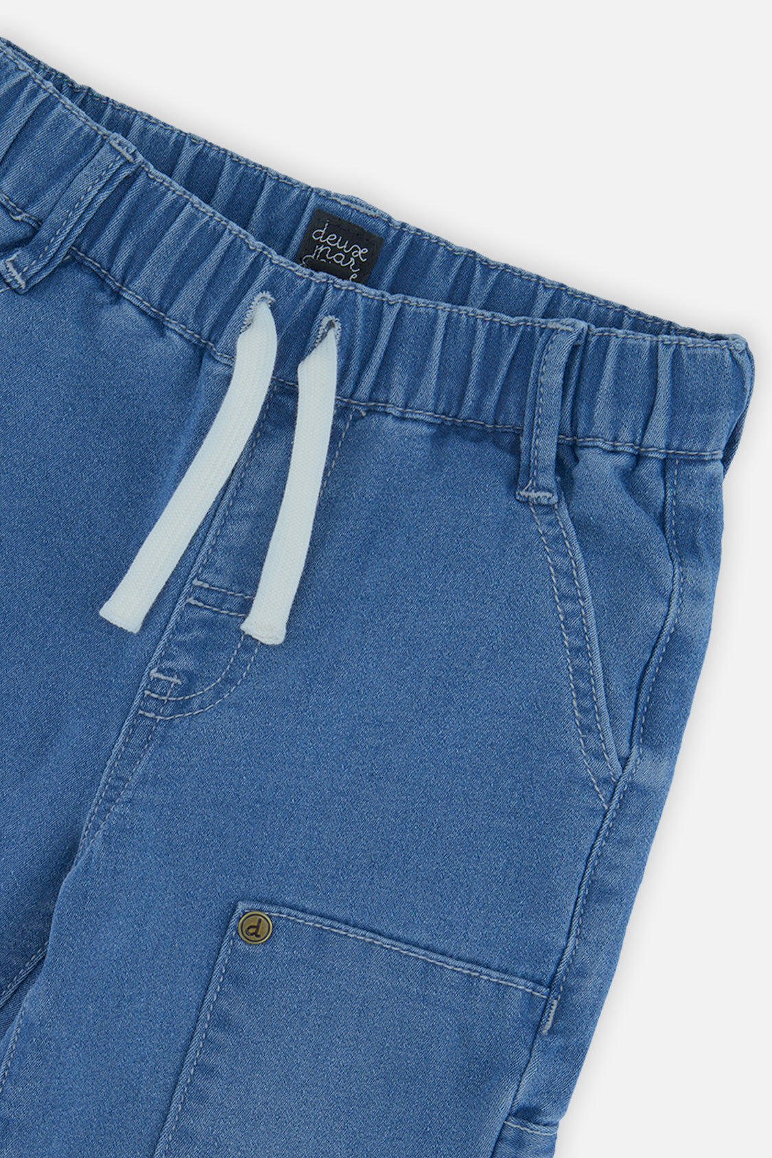 Close-up of the elastic waist, pale drawcord and cargo pocket on light blue French terry cargo pants
