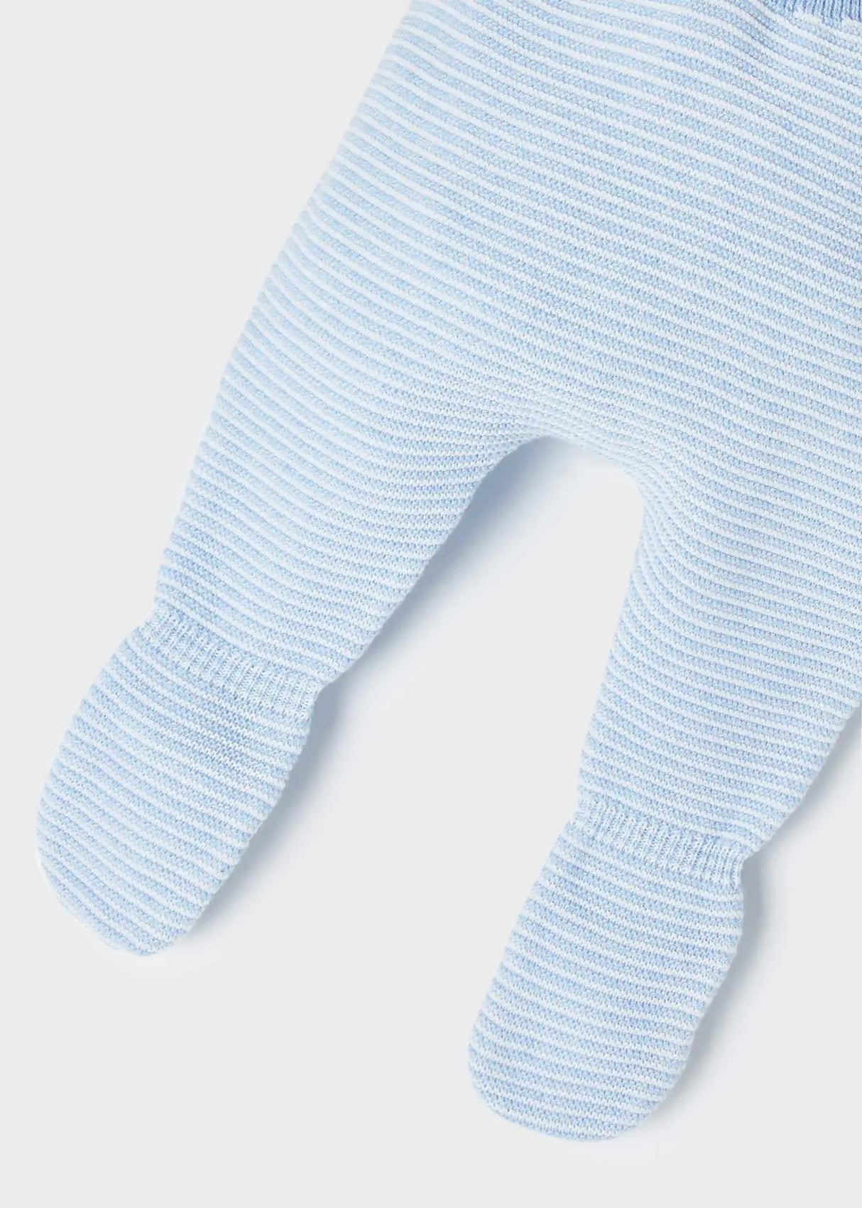 Detail of leg-warmer styling and elasticated waistband on leggings.