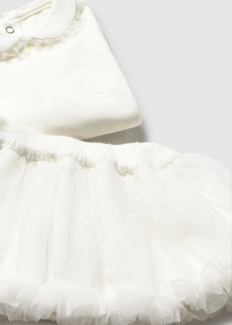 Close-up of Ivory skirt fabric with elastic waistband and soft ruffles