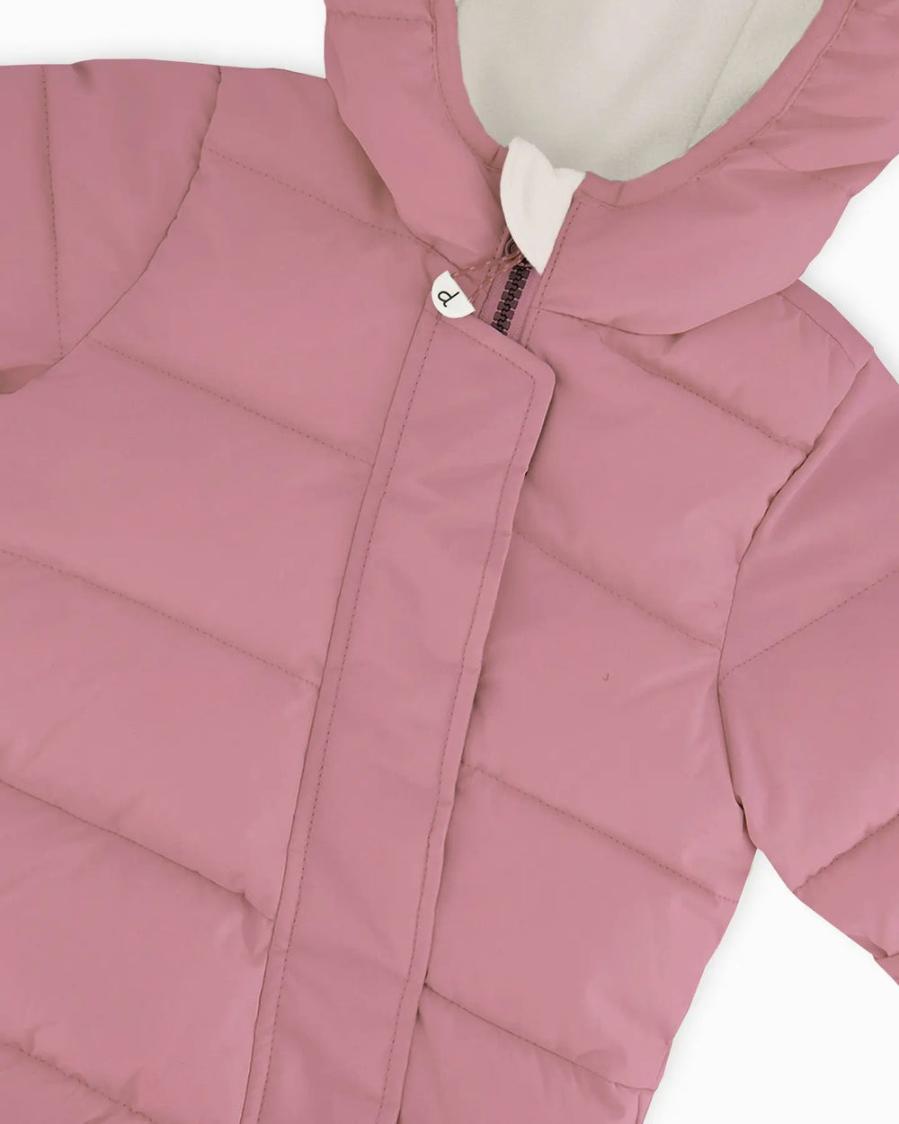 Close-up of quilting and zipper details on dusty pink snowsuit