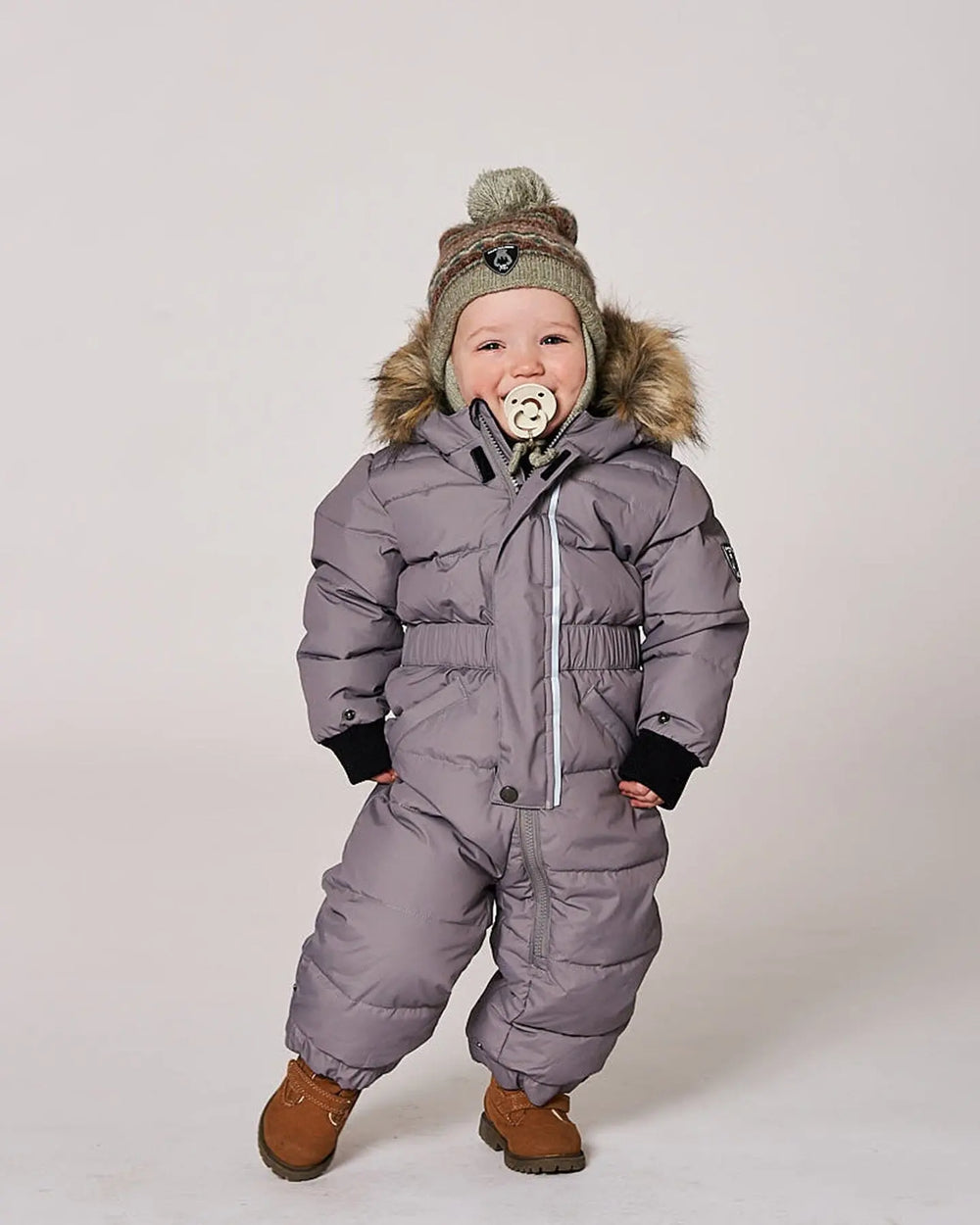 Baby wearing gray puffy snowsuit front view