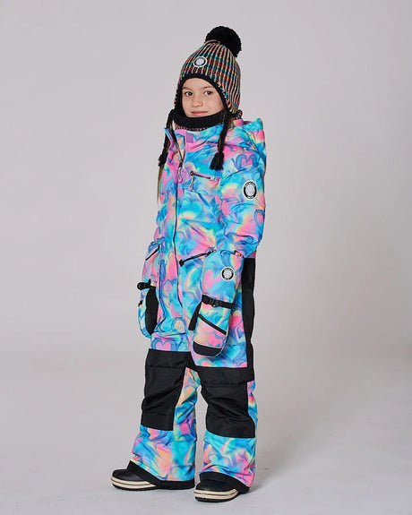 Side view showing articulated knees and ankle snow guards, one-piece ski suit.