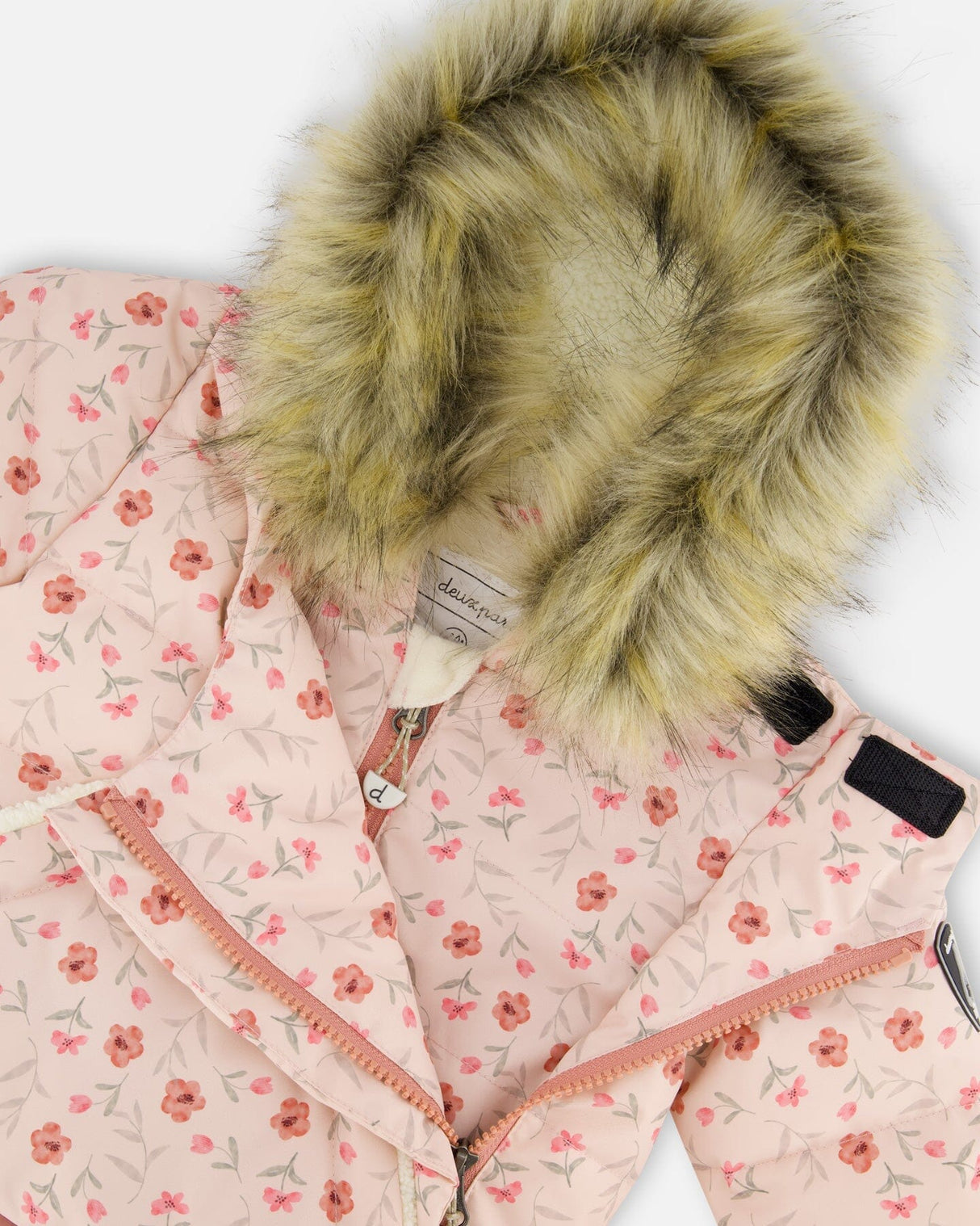 Close-up of water-resistant zipper and chin guard, baby girl snowsuit