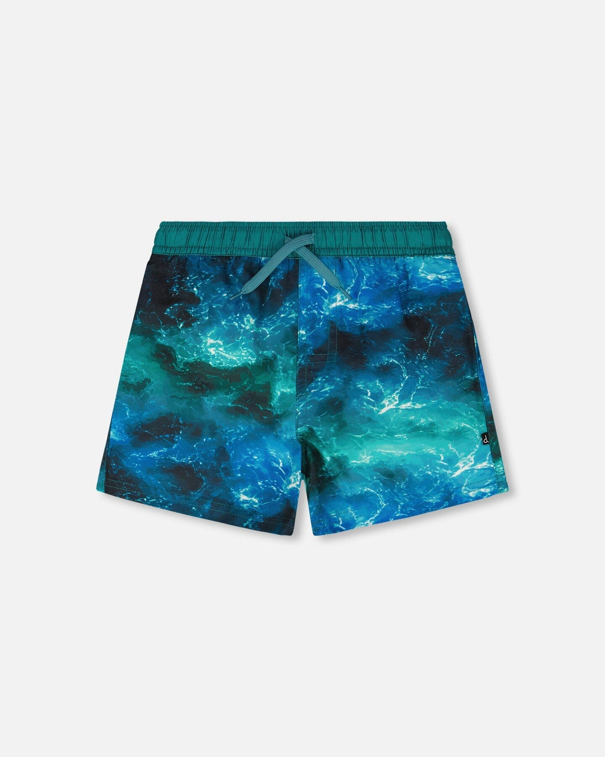 Front flat lay of Deux par Deux boy swim trunks in blue waves print