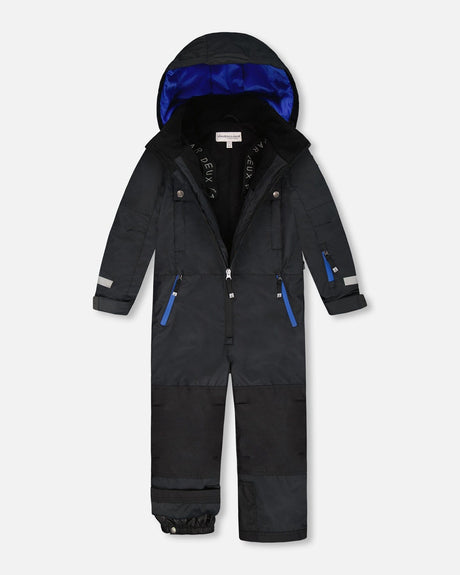 Teknik snowsuit showing adjustable pant hems