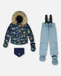 Flat lay baby two-piece snowsuit blue print jacket with gray pants, mitts and booties.