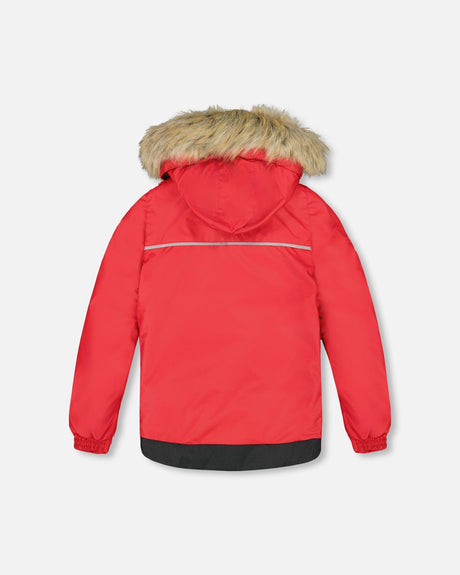 Back view of jacket and snow pants with suspenders, kids winter suit durability