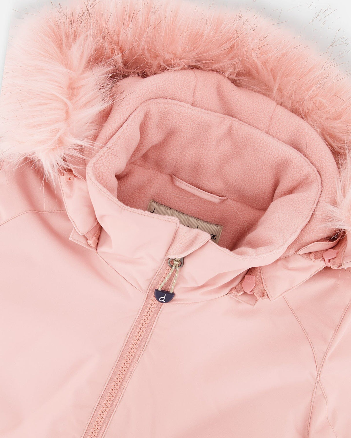 Inside jacket showing fleece lining and snow skirt, girls snowsuit