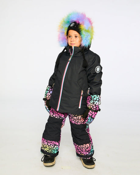 Action shot: rainbow leopard jacket and snow pants, breathable and cozy on the hill.