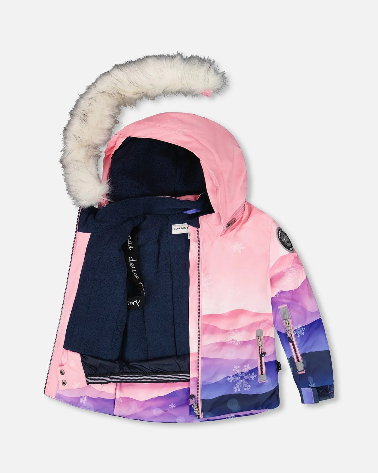 Inside of jacket showing fleece lining, wind flap, and pass pocket — kids winter suit.