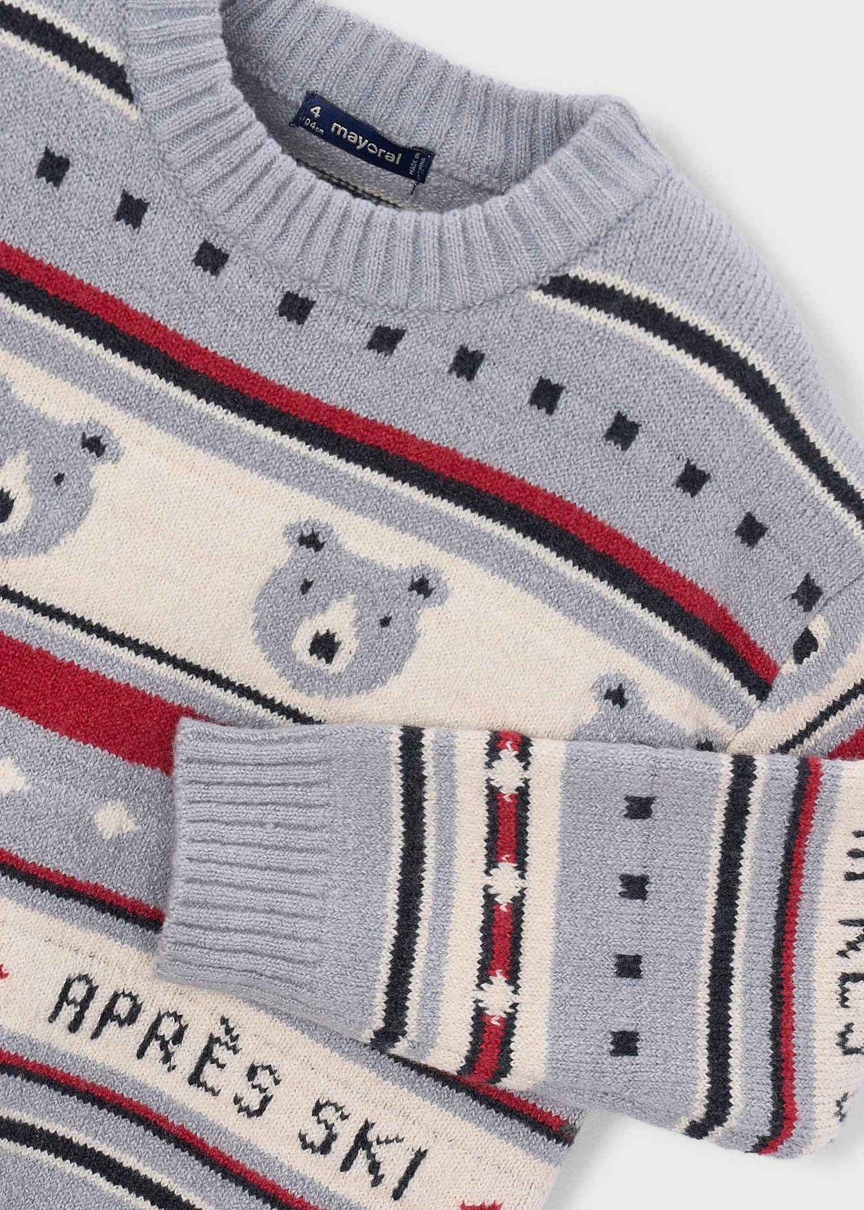 Close-up of Mayoral boys sweater showing polar bear jacquard artwork, Après Ski text, and cotton-rich knit texture.