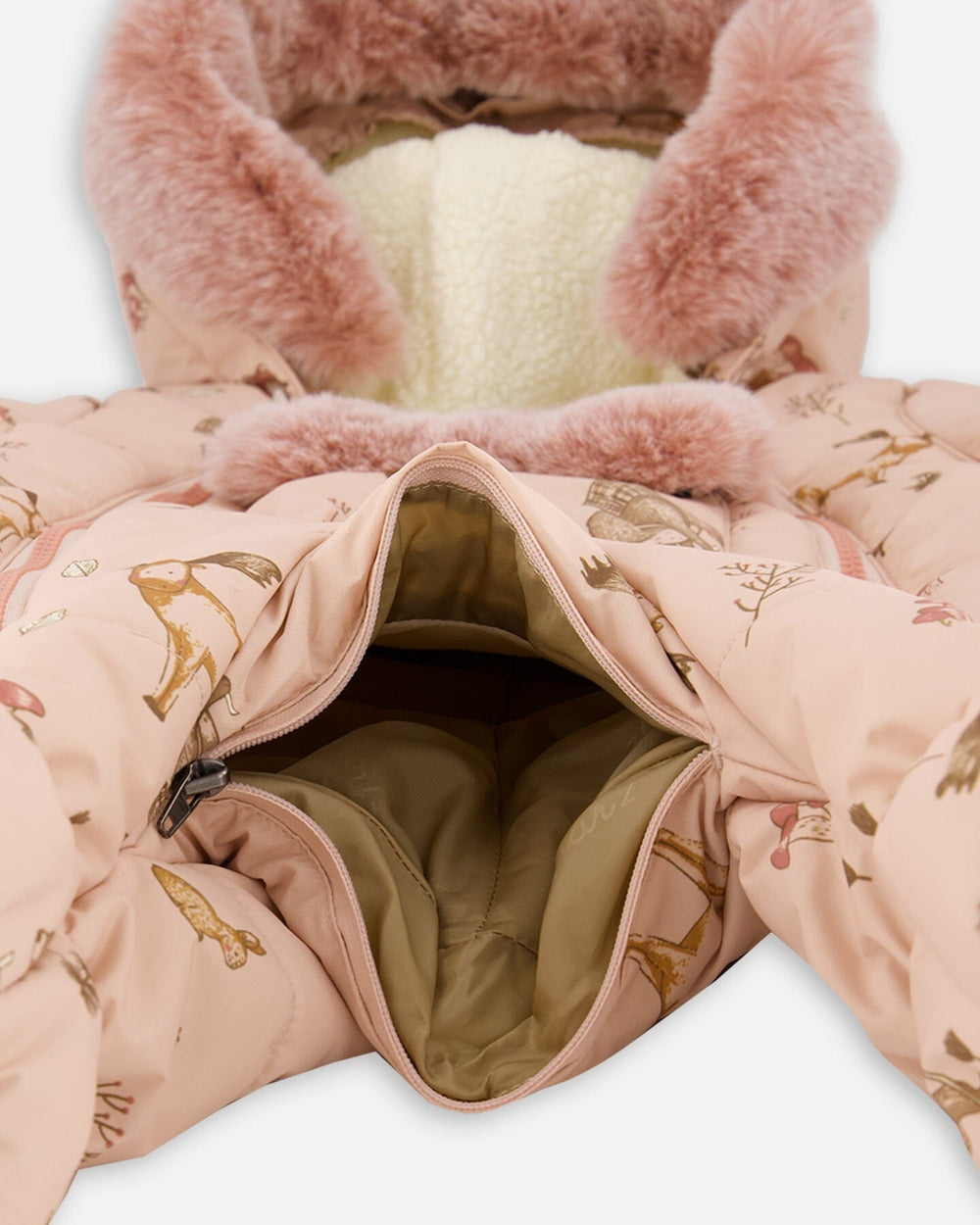 Detail shot of the velour-lined body and adjustable inner waist on the baby layette snowsuit