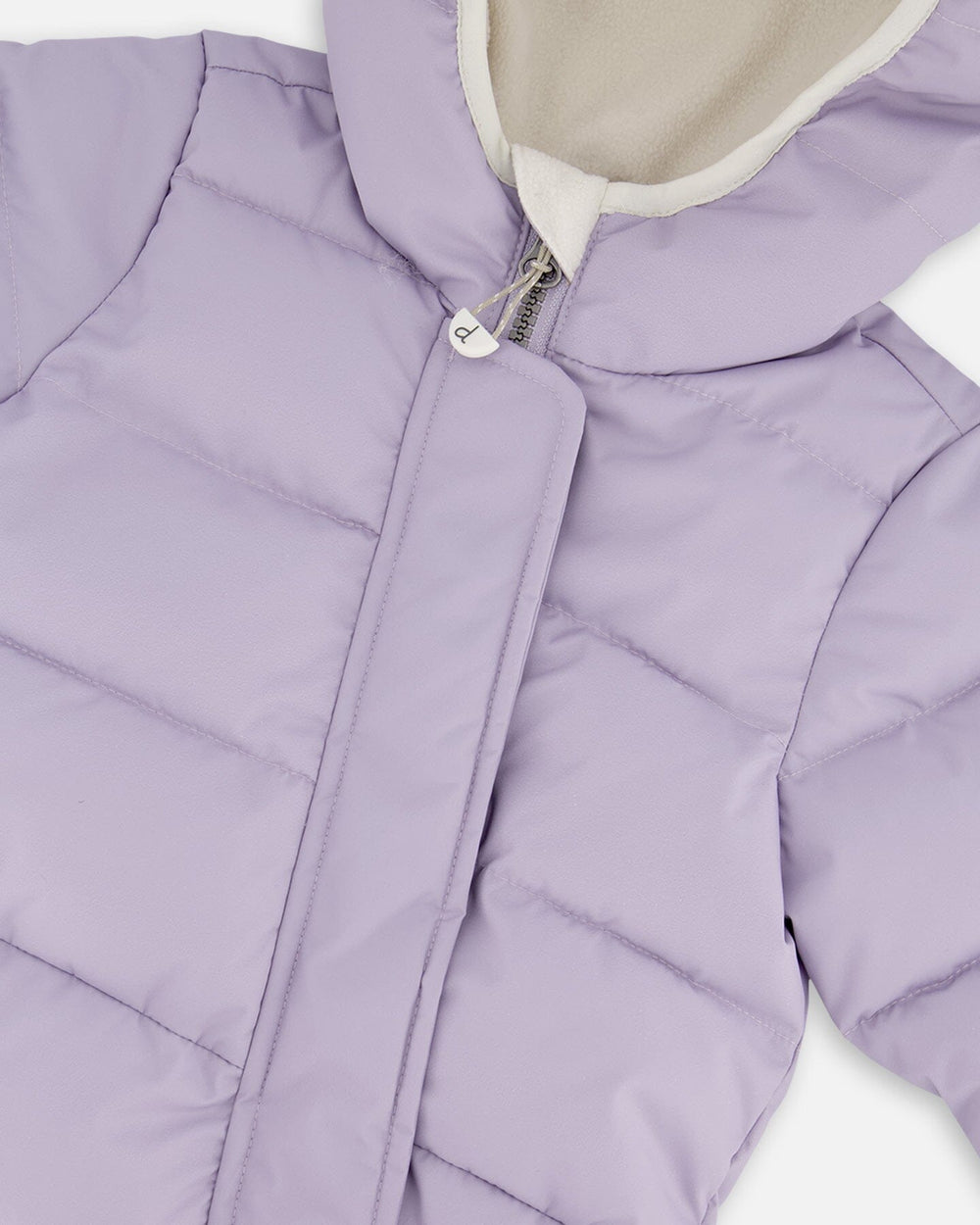 Close-up PrimaLoft quilting and zipper details purple gray snowsuit