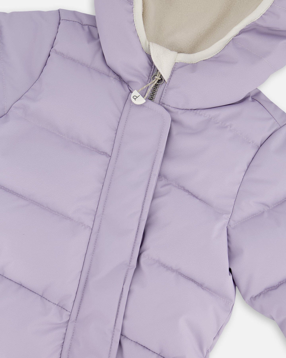 Close-up PrimaLoft quilting and zipper details purple gray snowsuit