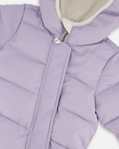 Close-up PrimaLoft quilting and zipper details purple gray snowsuit