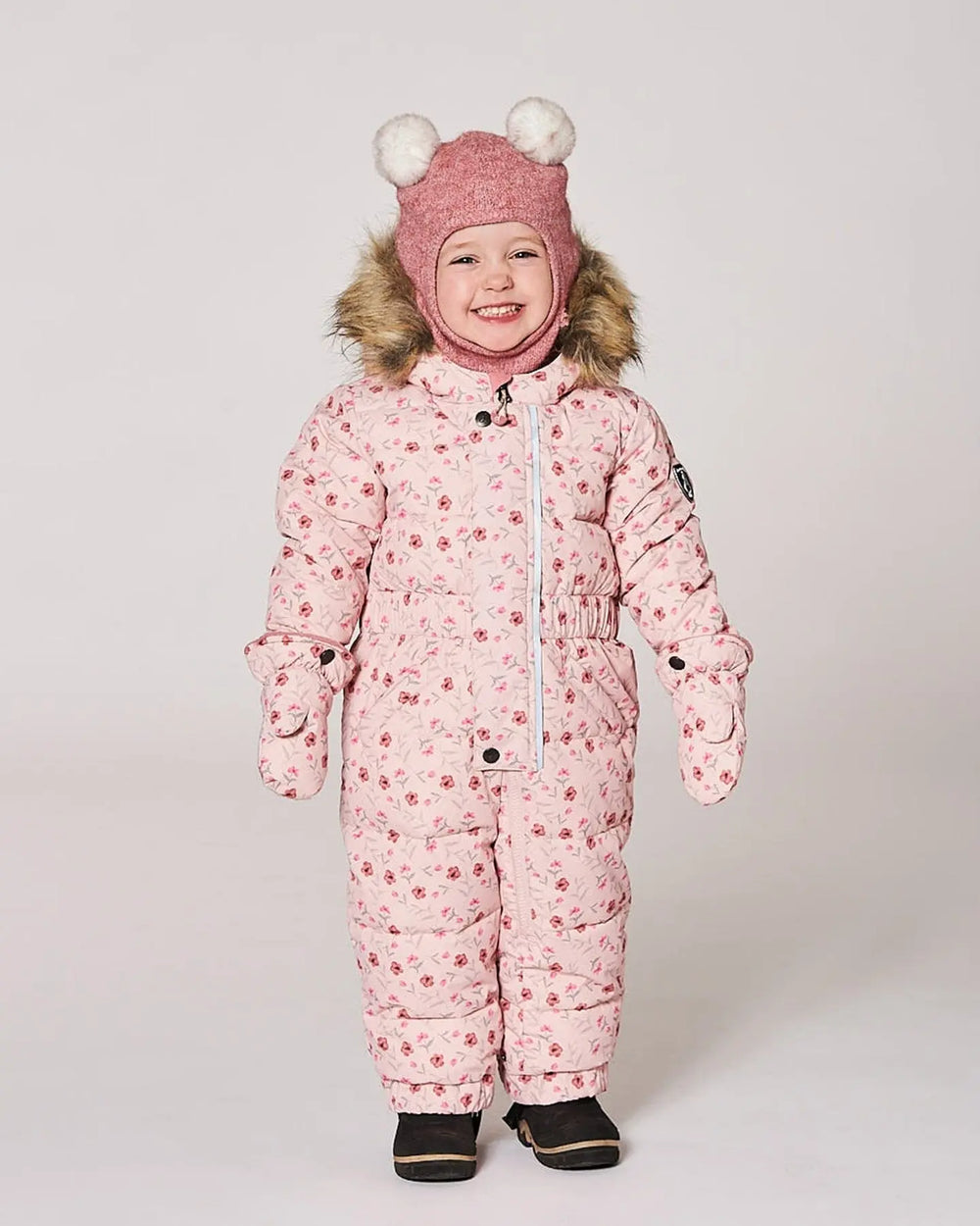 Baby girl wearing pink mini flowers puffy snowsuit front view