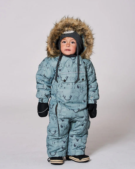 Infant wearing sage green animal print snowsuit with faux fur hood