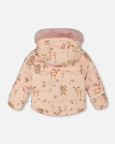Lifestyle photo of infant in dusty pink Baby Snug Deux par Deux snowsuit