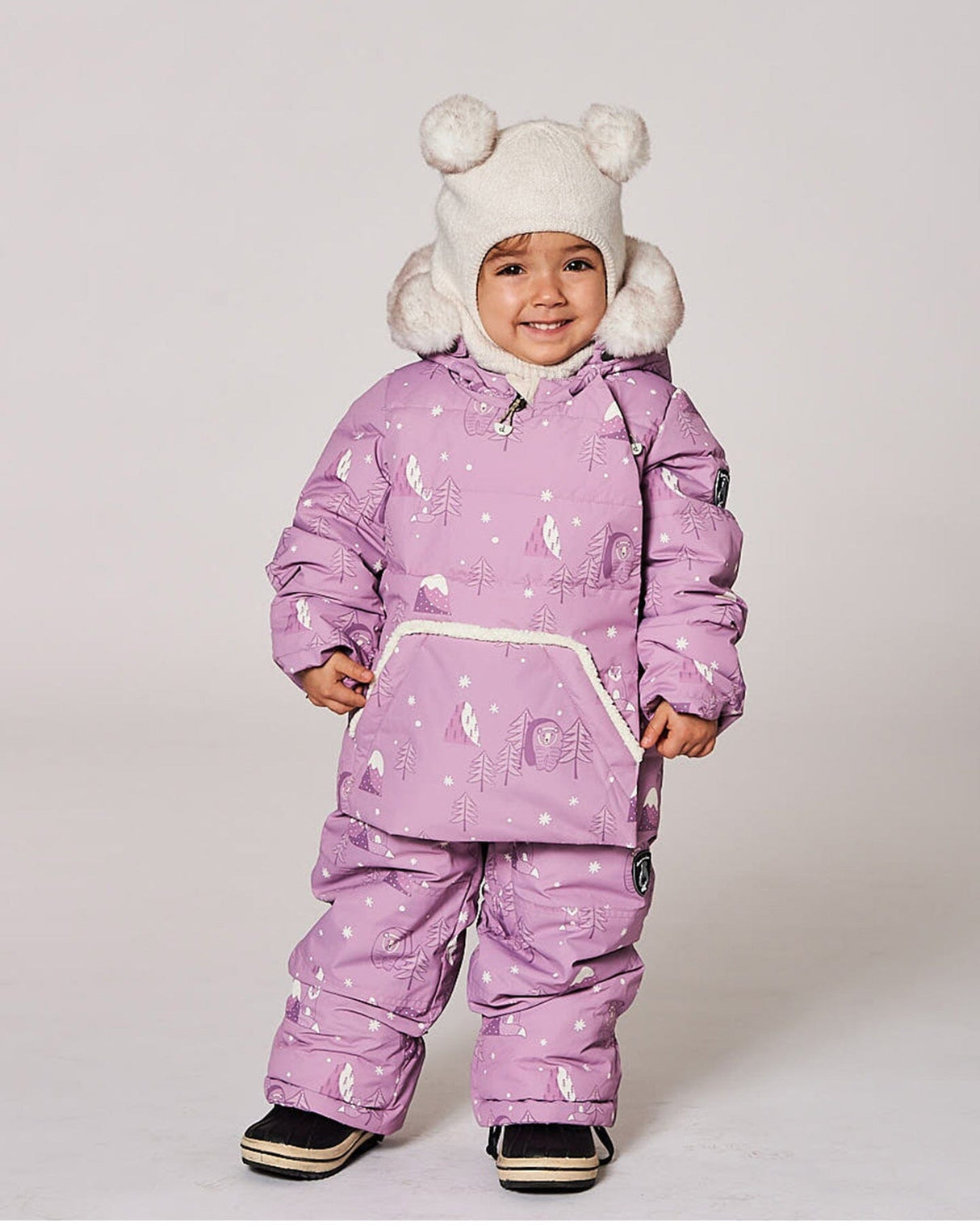 Toddler model wearing Deux par Deux purple bear print baby snowsuit