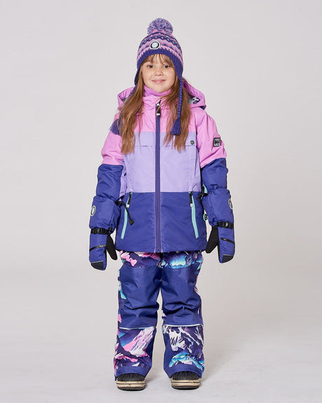 Lifestyle photo of child in Deux par Deux purple mountain snowsuit – order kids’ winter gear