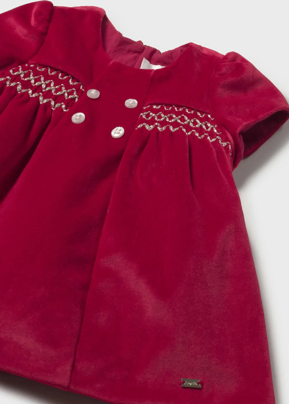 Close-up smocking on Mayoral newborn velvet dress red, elegant honeycomb design