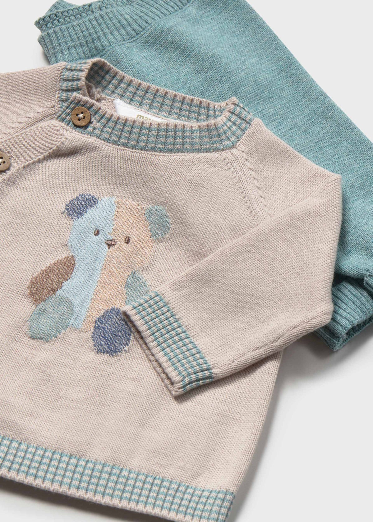 Close-up of the bear design, wooden buttons and checked trim on the Mayoral newborn knit sweater