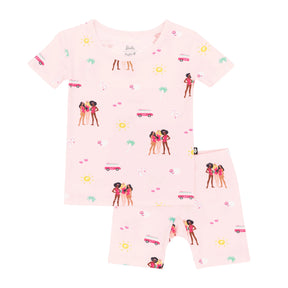 Kyte Baby girls Pink Barbie™ Beach bamboo short sleeve pajama set with matching shorts.